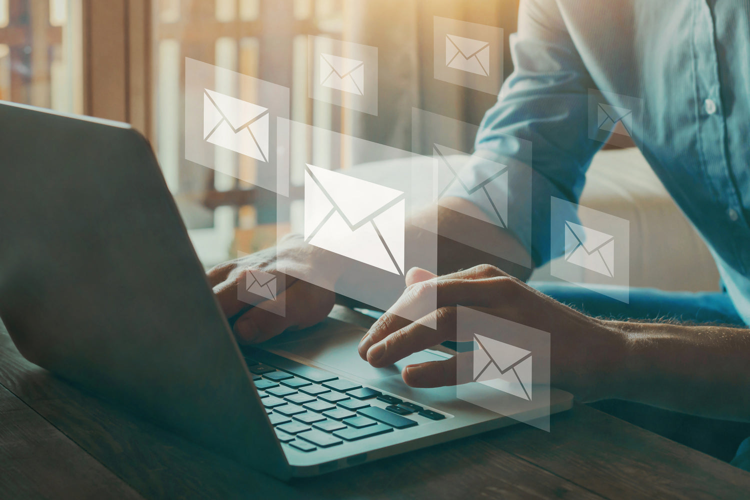 A person sending emails on their computer